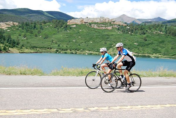 stonewall century ride cyclists having fun in gorgeous scenery in the mountains