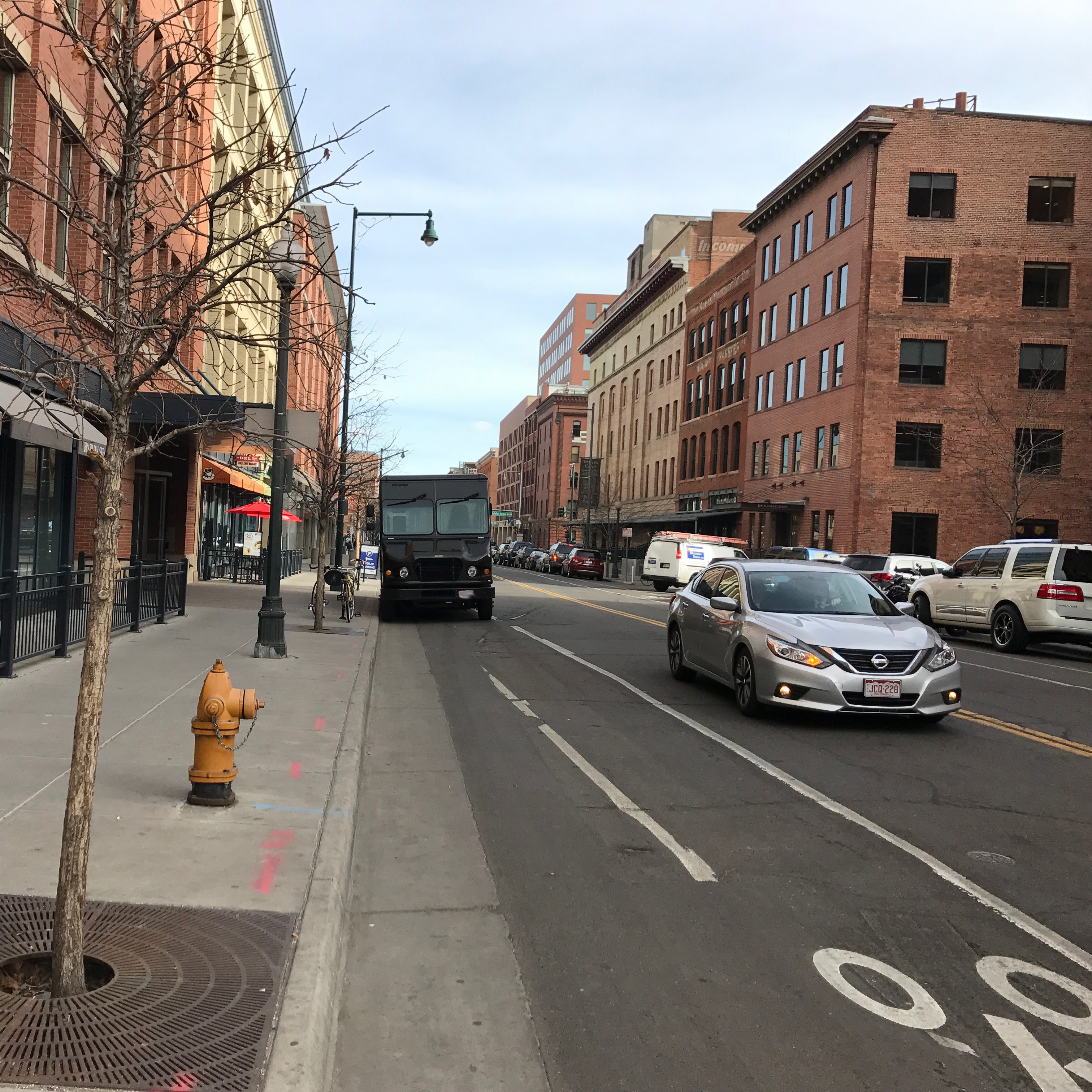 A UPS truck parked in a bike lane.