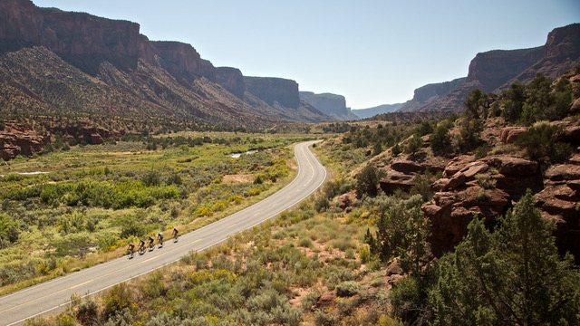 Aerial shot of riders biking through the desert