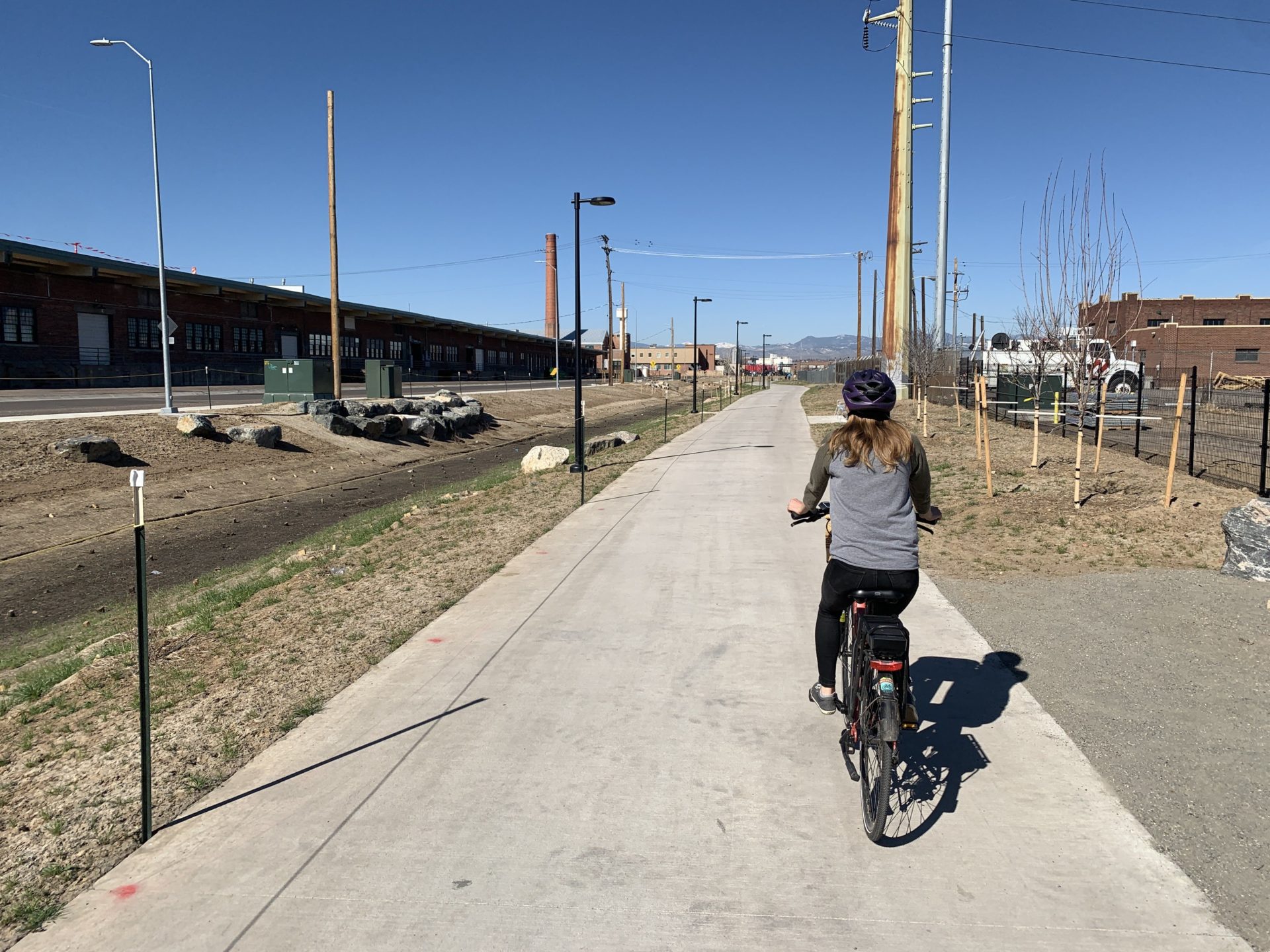 Woman biking on the 39th Avenue Greenway