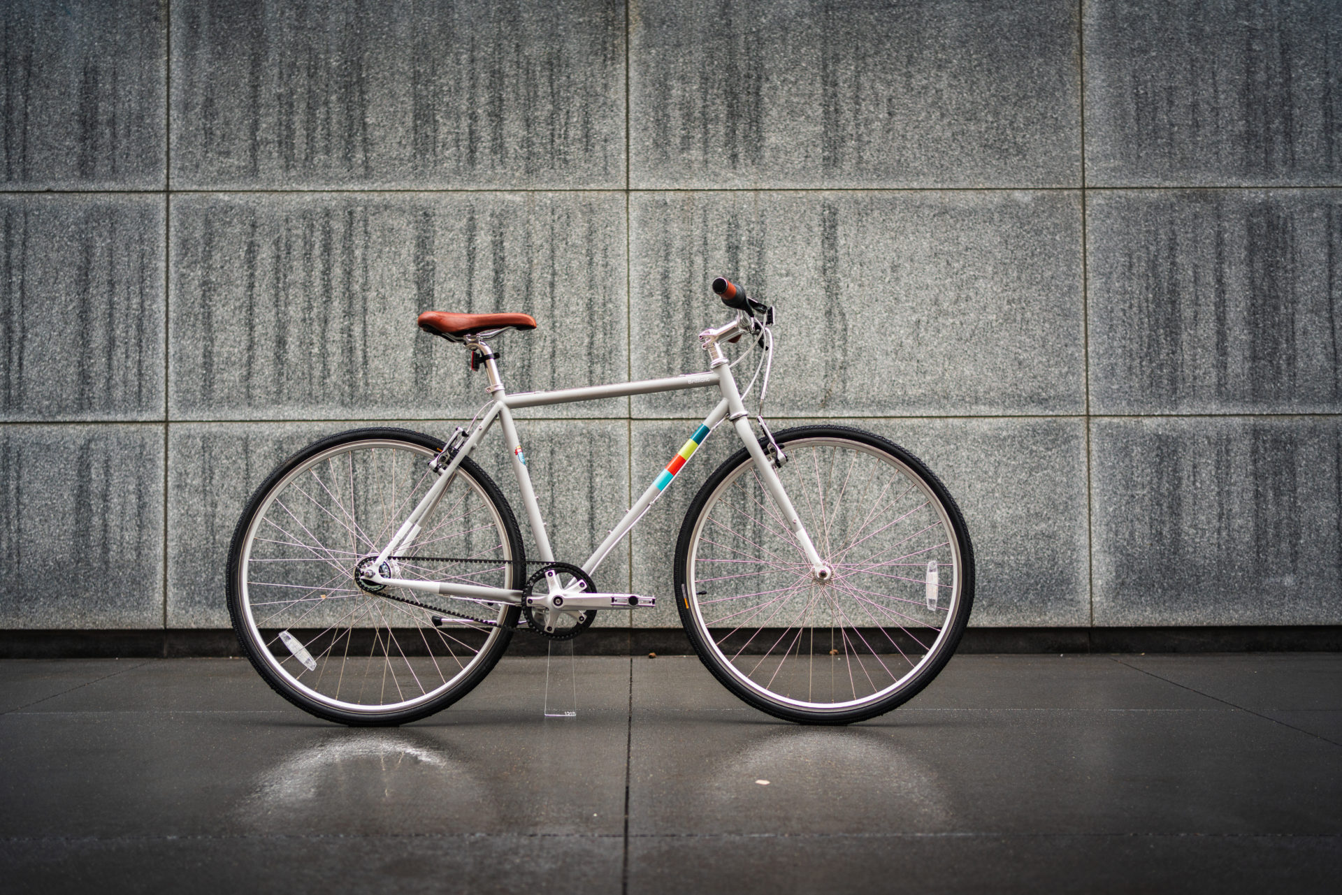 Grey commuter bicycle with disc brakes