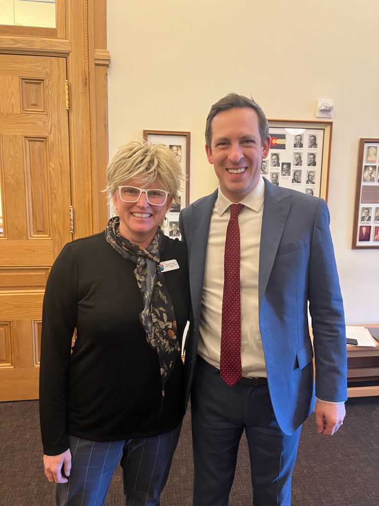 Bicycle Colorado policy director Rachel posing with Senator Steve Fenberg.