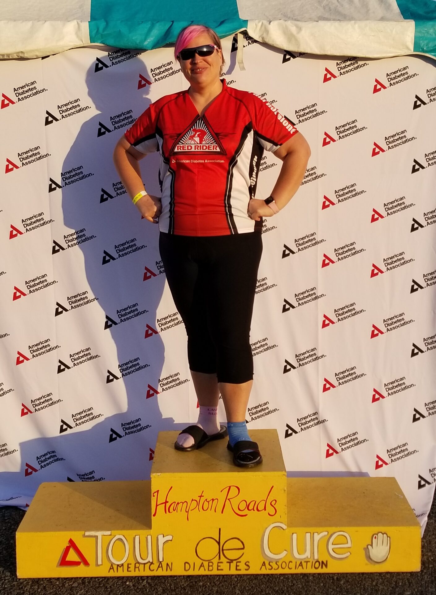 Photo of Sue _Sprint_ Gregory provided by donor Lane Lawrence Sue “Spring” Gregory posing on the Tour de Cure Hampton Roads American Diabetes Association podium